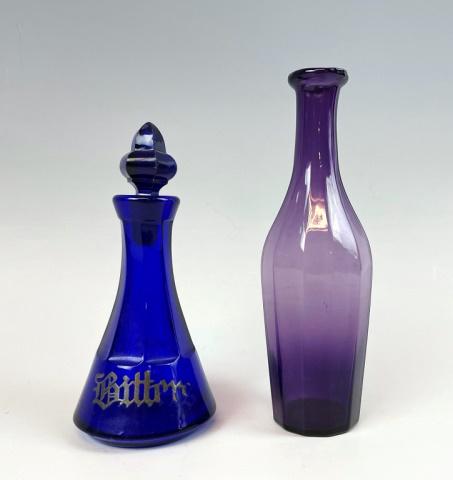 19th C. Blown Glass Bottles, Sandwich Glass: Two 19th C. Boston and Sandwich Glass Co. Bottles: (1) Deep amethyst colored twelve sided cologne bottle, (1) Cobalt blue colored bottle with stopper, painted "Bitters". Bottles in good condition, lar