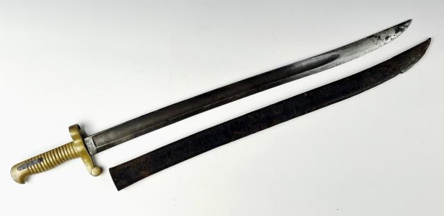 1859 Civil War Sword Bayonet, Ames Mfg Co: Civil War Saber Bayonet, Signed "US ADK 1859" (ADK Inspector indicates Ames Mfg. Co). Cast brass ribbed grip with channel and release button. Yataghan style single fullered steel blade. Bayonet with l