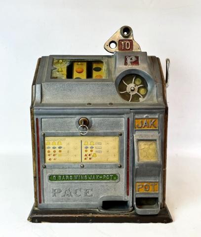 1930's Three Reel 10C Slot Machine, Pace Co: 1930's Three Reel 10 Cent Slot Machine, Signed "Pace Co". Cast metal case with wooden sides, removable back panel, rotating coin receiver, lever arm and three reels. Good functioning condition with ke