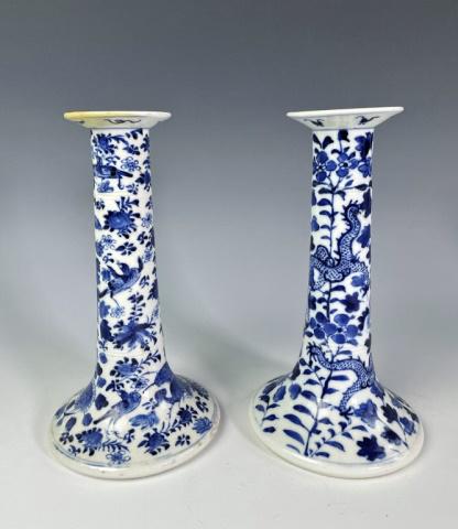 Chinese Qing Dynasty Porcelain Candlesticks (2pc): Pair of Chinese Qing Dynasty Blue and White Porcelain Candlesticks. Hand decorated with dragon and foliate designs. Good condition, some wax staining at top, measure: 8.25" H X 4.5" D.