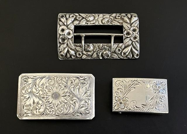 Sterling Silver Repousse and Chased Buckles (3pc): Three Silver Repousse and Engraved Belt Buckles: (1) 19th C. Floral Repousse Buckle, (2) Plate form buckles with hand chased floral engraving. Good condition, largest measures: 3.25" W, Total weight: 