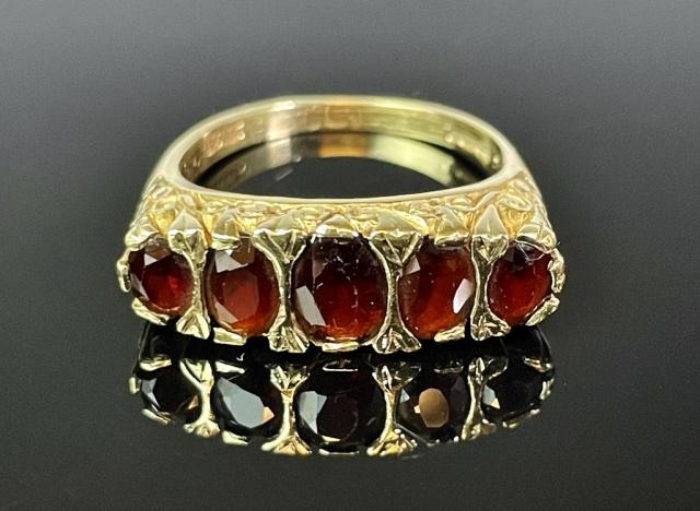 English Victorian Ladies 14K Gold and Garnet Ring: English Victoria 14K Gold and Garnet Ring. Stylized 14K yellow gold filigree ring with five graduated cut garnets of good quality. Good condition, assembled weight: 3.6 Dwt., 5.8 g. size 8.