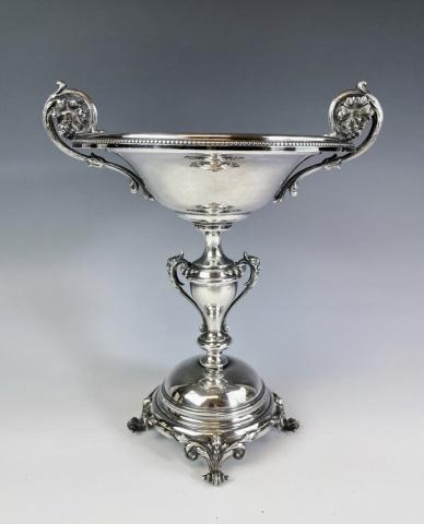 English Victorian Sheffield Plate Compote: Antique English Neoclassical Silver Plate Compote. Urn form base with floral scrolled handles. Good condition, measures: 11" H X 9.5" W X 8" D.
