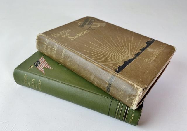Books, Boots And Saddles, Guidon, Custer (2pc): Two Books: (1) "Boots and Saddles, Or Life in Dakota with General Custer" by Elizabeth B. Custer (New York: Harper & Brothers, 1885), 8vo, hardcover, 312pp. Decorative cover with gilt title on front b