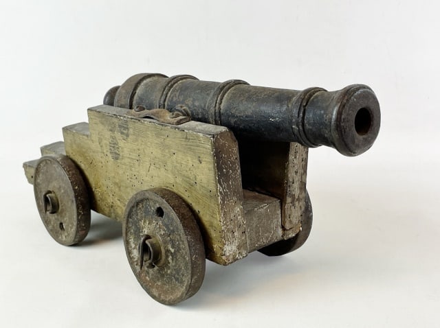 Early 19th C. Iron Signal Cannon: Early 19th C. Signal Cannon. Heavy cast iron tube with trunions and touch hole. Wooden carriage in period paint with cast iron wheels. Good condition, carriage with losses, powder post beetle holes, m