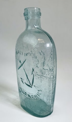 19th C. Baltimore Anchor Whiskey Flask Bottle: 19th C. Whiskey Flask, Baltimore Glass Works. Sides are embossed with an anchor, reverse with a phoenix and "RESURGAM". Seamed body with smooth base and applied ring at lip. Excellent condition with h