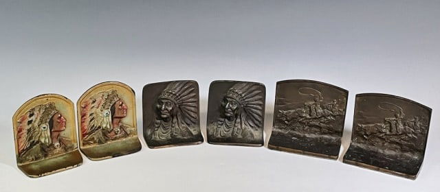 Three Pairs Antique Western Themed Bookends (6pc): Three Pairs of Antique Western Themed Bookends: (1) Pair in cast bronze with Plains Indian in headdress, (1) Pair in painted cast iron of Plains Indian in Headdress, (1) Pair in cast bronze of cowboys