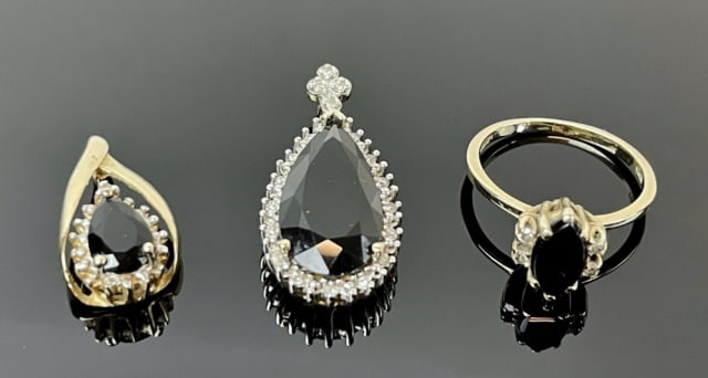 14K Gold, Black Onyx and Diamond Jewelry (3pc): Collection of 14K Gold, Black Onyx and Diamond Jewelry: (1) 14K yellow gold ring set with center onyx stone, flanked by four small round cut diamonds, ring size 6 (1) 14K yellow gold pendant, set with
