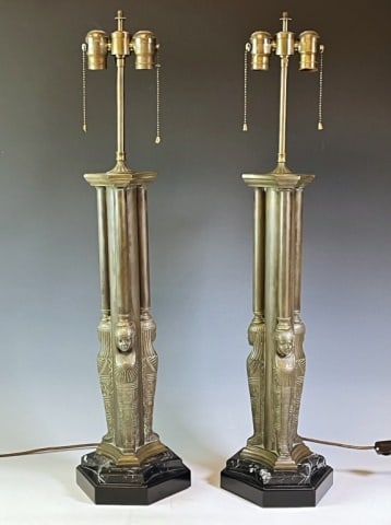 Antique French Bronze Egyptian Revival Lamps (2pc): Antique Early 20th C. French Cast Bronze Egyptian Revival Lamps. Heavy cast bronze bases with figural Egyptian sarcophagi on polished stone bases with pillars terminating with two socket light fixture