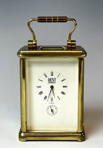 Antique English Carriage Clock, Dent, London: Antique English Carriage Clock, Signed "Dent, London". Eight -day keywind movement with open escapement. White porcelain face with Roman Numeral radial dial and sub seconds dial. Glazed brass case wit