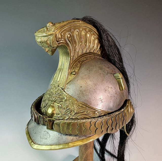 Antique French Model 1870 Cuirassier Helmet: French Model 1870 Cuirassier Helmet. Steel body with brass decorative hardware, horsehair comb, front plate and chin scales. Interior with leather liner. Excellent condition with wear, measures: 10" H