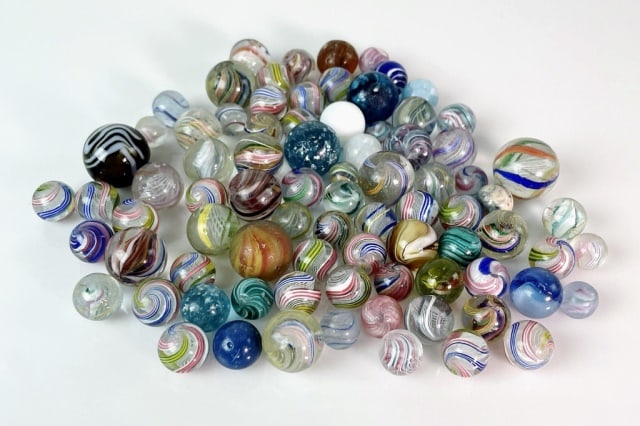 Antique German Blown Glass Marbles (78pc): Collection of Seventy-Eight Antique German Hand Blown Marbles. Diverse colors, swirls and surfaces. Good condition with wear from use, largest measures: .9" D.