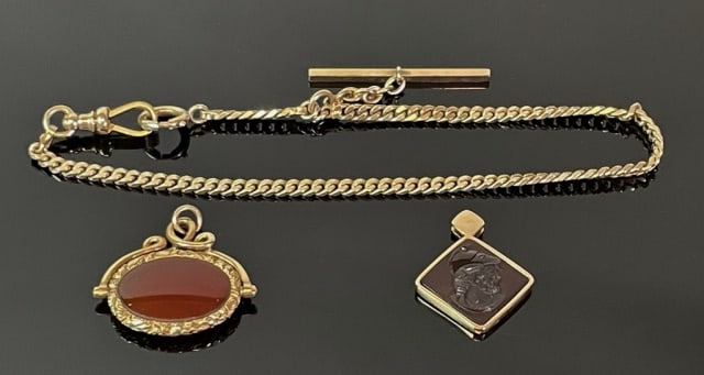 Antique 10K Gold Watch Chain, Fobs (3pc): Antique 10K Gold Watch Chain, Fobs: (1) Watch chain crafted of 10K yellow gold, (1) 14K yellow gold fob set with neoclassical carved carnelian stone, (1) 14K yellow gold fob set with polished carnelia