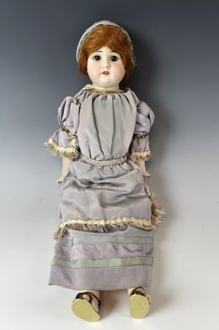 Antique German Bisque Doll, Armand Marseille: Antique German Bisque Headed Doll, Armand Marseille. Decorated bisque porcelain head with movable eyes and human hair. Jointed body clothed in dress with hair scarf. Good condition with wear, measures