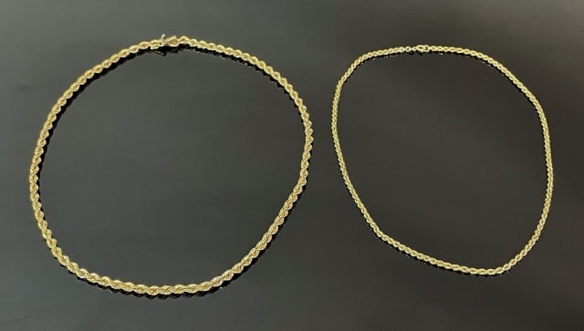 14K Gold Necklaces and Bracelet (3pc): Collection of 14K Gold Jewelry: (1) 14K yellow gold twisted wire bangle bracelet, (1) 14K yellow gold rope necklace, (1) 14K yellow gold rope necklace. Excellent condition, largest measures: 22.5 L, c