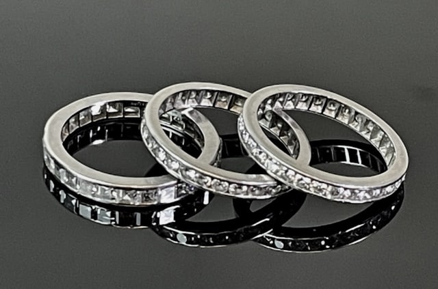 14K Gold and Diamond Band Rings (3pc): Three 14K Gold Pave Diamond Bands. 14K white gold, two rings with twenty eight round cut diamonds, one ring with twenty square cut diamonds. Excellent condition, total assembled weight: 4.6 dwts, 6.8 