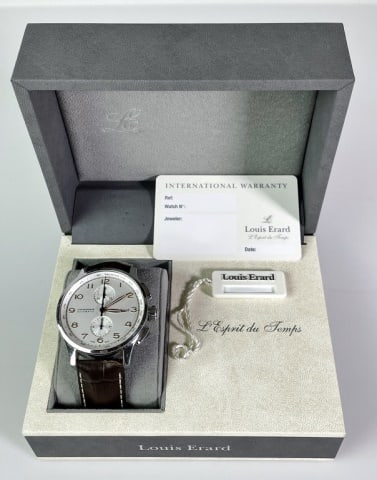 Men's Swiss Watch Automatic Chronograph, Erard: Men's Swiss Automatic Chronograph Wristwatch, Signed "Louis Erard". Automatic movement with tachymeter function. Silvered face with radial Arabic Numeral dial with two tachymeter sub dials with button