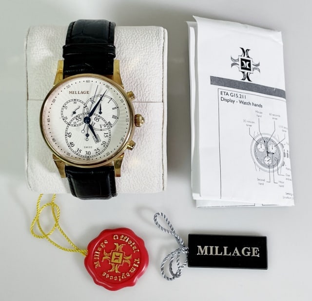 Men's Swiss Wristwatch, Millage: Men's Swiss Wristwatch, Signed "MILLAGE". Swiss quartz movement, time, date, sub seconds. White face with radial Arabic and Roman Numeral dials with button set timer function. Gilt steel case and leat