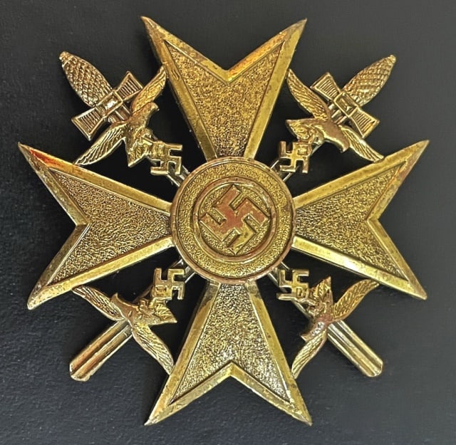 WW2 German Spanish Cross in Gold, L/15: World War Two German Spanish Cross In Gold. Die struck badge of stylized cross dissected by swords with Luftwaffe style eagle. Reverse with hinged pin, stamped "L/15" (Otto Schickle) maker mark. Weigh