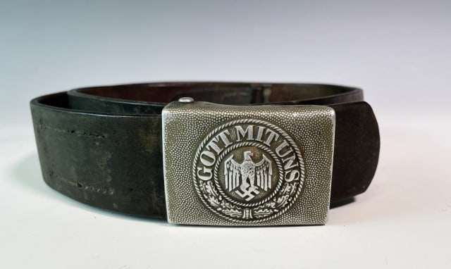 WW2 German Army Belt and Buckle, GI Inscription: World War Two German Army Belt and Buckle. Die struck steel buckle with "GOTT MIT UNS" slogan. Belt with semi-legible scratched G.I. information and '44 date. Belt and buckle in good condition with we
