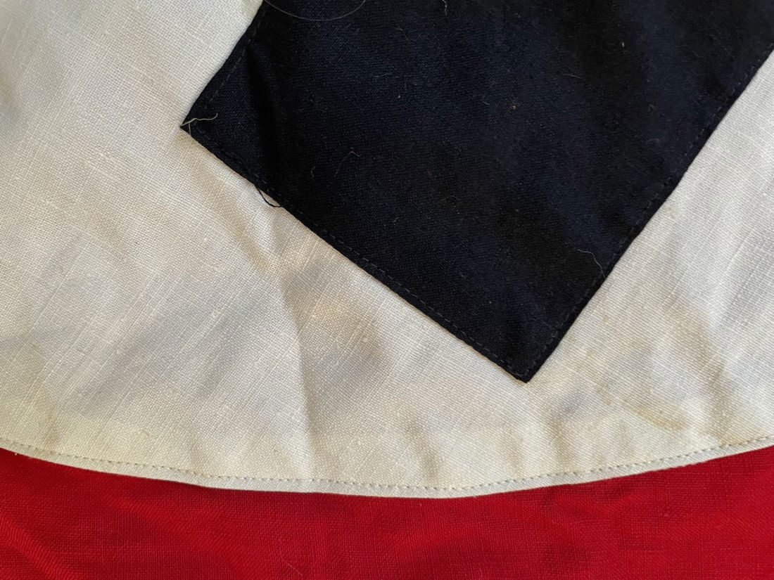 WW2 German NDSAP Flag Banner: World War Two German NDSAP Flag or Banner. Multi-piece sewn wool and linen construction with center medallion and paper RZM tag affixed. Excellent condition, measures: 33" H X 56" W NOTE: WE OFFER DOM