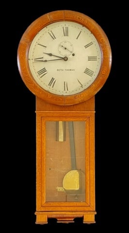 Antique Regulator Wall Clock, Seth Thomas No 2: Antique Regulator Wall Clock, Signed "SETH THOMAS". Model number 2, weight driven eight-day clock. Oak case, white face with roman numeral radial dial with sub seconds dial. Excellent working conditio