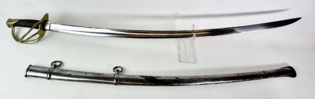 Civil War M1840 Cavalry Sword, Ames 1849: Civil War Model 1840 Cavalry Sword, Ames, Chicopee Mass dated "1849". Curved single fullered steel blade, brass three branch guard and brass wire wrapped leather grip. Excellent condition with bright