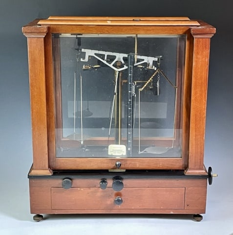 Antique Cased Scientific Scale, Christian Becker: Antique Scientific Scale, Signed "Christian Becker". Glazed wooden case with lower drawer. Interior steel and brass beam scale, accompanied by two sets of cased weights and accessories. Excellent cond