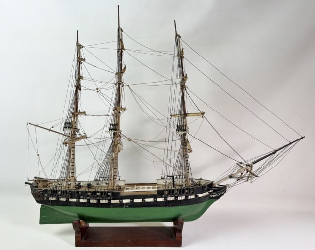 Antique Wooden Ship Model of U.S. Frigate: Antique Scratch Built Wooden Ship Model of a War of 1812 era USN Frigate. Wood hull with cannon ports and moveable rudder, three masts with detailed blocks and rigging. Good condition with losses to r
