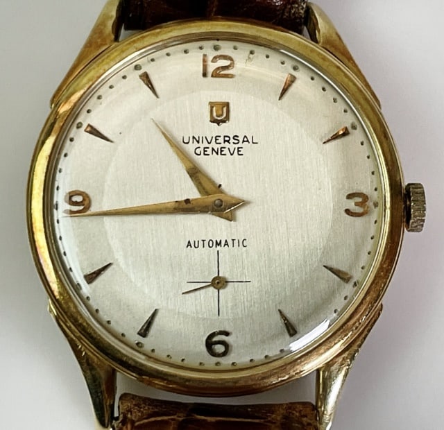 Vintage Swiss Automatic Watch, Universal Geneve: Vintage Men's Swiss Automatic Watch, Signed "UNIVERSAL GENEVE". Watch with automatic movement, silvered face with Arabic Numeral and baton radial dial with sub seconds dial. Gold filled case with leat