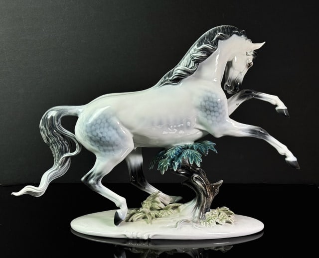 German Porcelain Sculpture, Rosenthal: German Porcelain Sculpture of a Rearing Horse. Hand decorated glazed porcelain figure, base signed "Classic Rose Rosenthal Group Germany" Excellent condition, measures: 12" H x 16.5" W x 4.5" D.