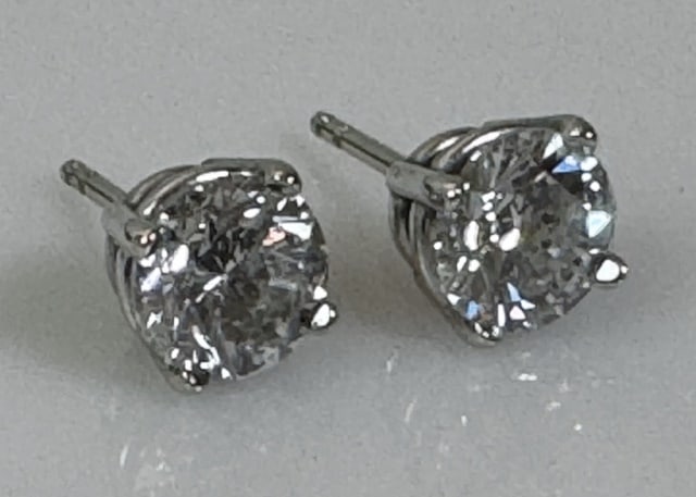 Pair of Ladies Diamond Stud Earrings (2pc): Pair of Ladies Diamond Stud Earrings. 14K white gold with guardian backs, each prong set with one round modern brilliant cut natural diamond, evaluated as I-J color, SI3 clarity and approximately 1.00