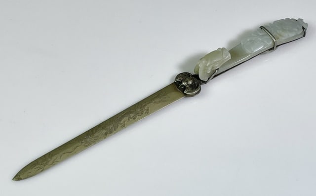 Chinese Qing Dynasty Jade Buckle Letter Opener: Chinese Qing Dynasty Carved Jade Buckle Letter Opener. Bronze blade with engraved dragon and reverse geometric decoration, Handle with carved jade dragon head buckle. Good condition, measures: 9.25" L