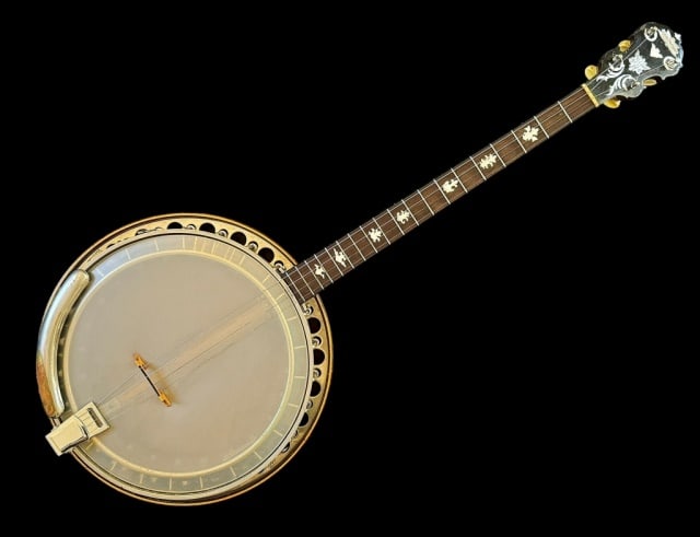 1930's Tenor Banjo, Paramount Style B: 1930's Tenor Banjo, Signed "PARAMOUNT Wm. L. Lange Style B" Four string banjo,headstock with mother of pearl logo and scroll decoration, mother of pearl inlayed fret board. Nickeled reticulated rim wi