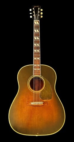Acoustic Guitar, Gibson, Sunburst Southern Jumbo: 1949-51 Acoustic Guitar, Gibson, Southern Jumbo. Six string acoustic guitar with spruce and mahogany body with five ply binding, rosewood fretboard with faux mother of pear inlay. Headstock signed "Gi