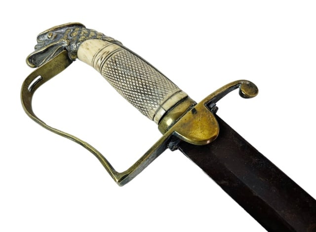 War of 1812 American Eagle Head Cavalry Sword: War of 1812 Era American Eagle Head Cavalry or Mounted Artillery Sword. Large single fullered steel blade with brass stirrup form gaurd and eagle head pommel, carved checkered grip. Good condition, sw