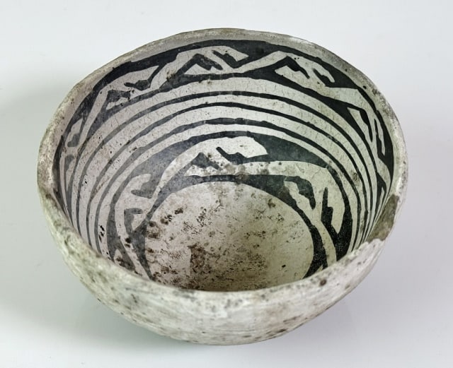 Ancient Anasazi Indian Pottery Bowl: Pre-Columbian Southwest Indian (Anasazi) Indian Pottery Bowl. Hand thrown bowl with white surfaces and repetitive geometric pattern in black. Fair condition with loss at lip, measures: 2.5" H x 4" D