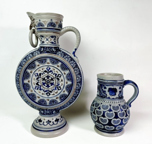 Two German Porcelain Ewers (2pc): Two German Porcelain Ewers. (1) Neoclassical form with detailed cobalt and gold decoration, (1) Jug form ewer with cobalt decoration. Good condition, larger measures: 14.5" H x 9" W x 4" D.