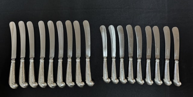English Sterling Pistol Handled Knives (18pc): Eighteen Antique English Sterling Silver Pistol Handled Dinner and Bread Knife Set with Steel Blades, Signed "C.J. Vander & Co." Set includes: (9) Dinner size knives, (9) Bread knives. Good condition 