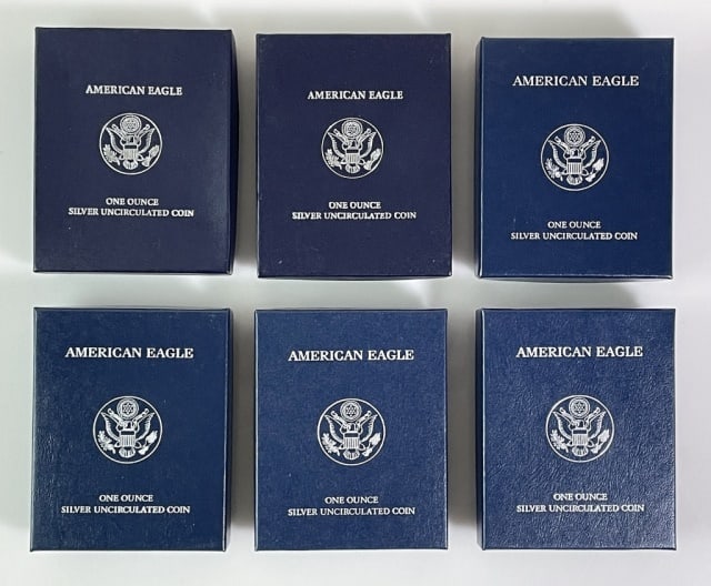 US Mint 1 Oz American Silver Eagles, BU (6pc): Six U.S. Mint 1 oz American Silver Eagles in Brilliant Uncirculated Condition: (2) 2011, (2) 2008, (2) 2007. Eagles are accompanied by U.S. Mint Packaging and COA's.