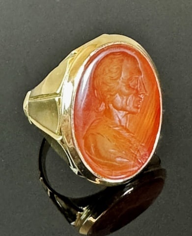 Antique 14K Gold Carnelian Intaglio Ring: Antique English 14K Gold Carnelian Intaglio Ring. Carnelian stone carved with bust of John Pope bezel set into 14K yellow gold ring. Total combined weight: 10.3 dwts, 15.9 g. Ring size: 9
