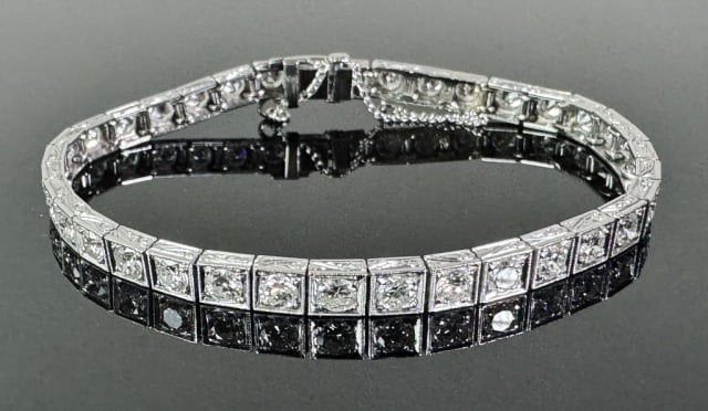 Antique 14K Gold Diamond Art Deco Bracelet: Antique Art Deco 14K Gold and Diamond Bracelet. 14K white gold link bracelet set with thirty-six well matched .20 cts round cut diamonds of excellent quality (approximately 7.2 cts total). Total assem