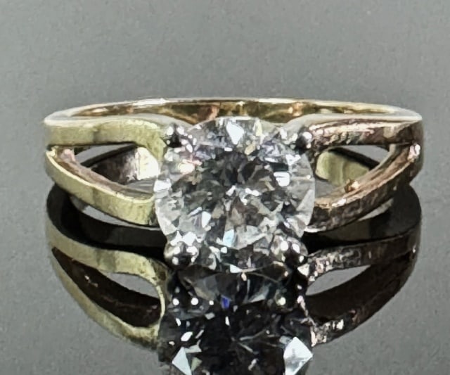 14K Gold Diamond Solitaire Ring: 14K Gold Diamond Solitaire Ring. Crafted of 14K yellow gold prong set with one round modern brilliant cut diamond evaluated as 1.2 cts, SI3 and D color. Total assembled weight: 2.7 dwts, 4.4 g, Ring S