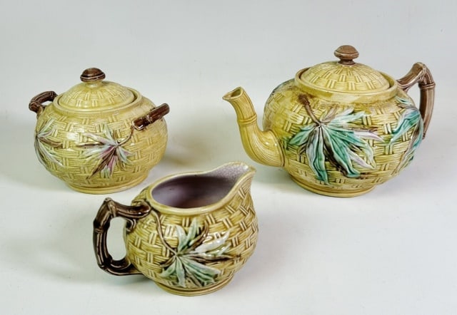 Antique English Majolica Teaset (3pc): Three Antique English Majolica Teaset. Teapot, sugar and creamer, basket weave foliate decoration, base signed with maker mark. Good condition (teapot with loss under cover), largest measures: 5" H x 