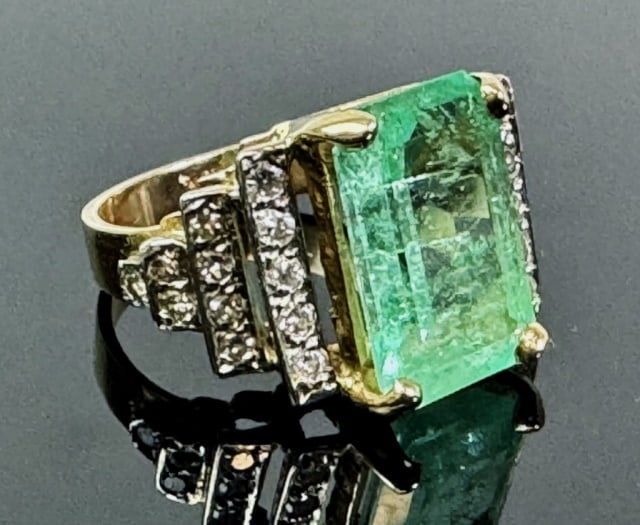 Antique 14K Gold Emerald and Diamond Ring: Antique 14K Gold Emerald Ring. Emerald cut center stone flanked by twenty-four round cut diamonds. Total assembled weight: 3.3 dwts, 5.1 g, Ring size 5.
