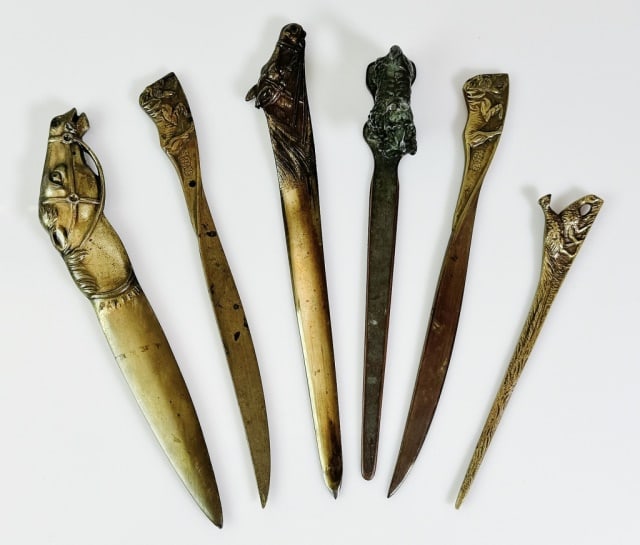 Antique Bronze Figural Letter Openers (6pc): Collection of Six Figural Bronze and Brass Letter Openers. Crafted of cast bronze with handles of diverse natural themes. Good condition with wear, largest measures: 9" L.