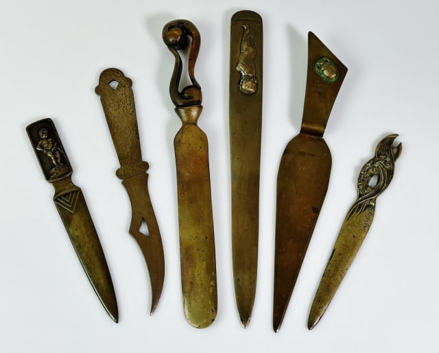 Antique Cast Bronze Letter Openers (6pc): Collection of Antique Cast Bronze Letter Openers. Diverse sizes and design motifs. Good condition with patina, largest measures: 11" L
