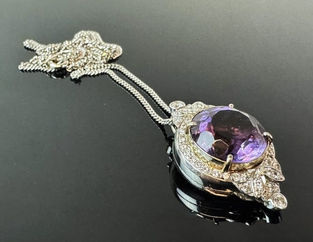 18K Gold Necklace, Amethyst and Diamond Pendant: 18K Gold Necklace with Amethyst and Diamond Pendant. Crafted of 18K white gold with center round cut amethyst with pave diamond surround. Total assembled weight: 7.8 dwts, 12 g.