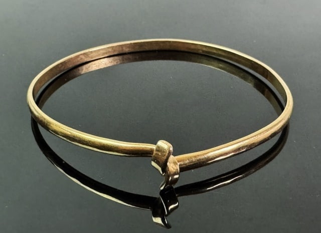 14K Gold Cuff Bracelet: 14K Gold Cuff Bracelet. Crated of 14K yellow gold, cuff style bracelet with hook closure. Weight: 5.9 dwts, 9.1 g.