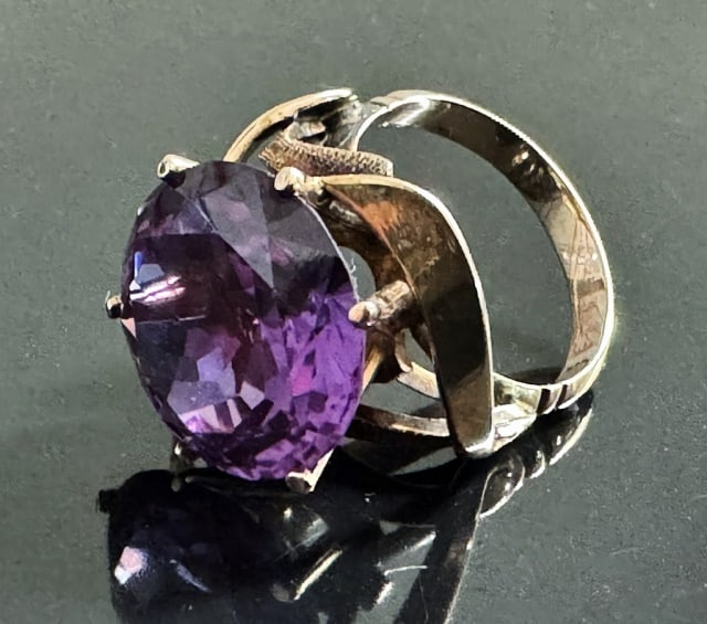 14K Gold Color Changing Sapphire Ring: 14K Gold Color Changing Sapphire Ring. Crafted of 14K yellow gold set with excellent round cut color changing sapphire evaluated approximately 14.5 cts. Total assembled weight: 5.5 dwts, 8.7 g.